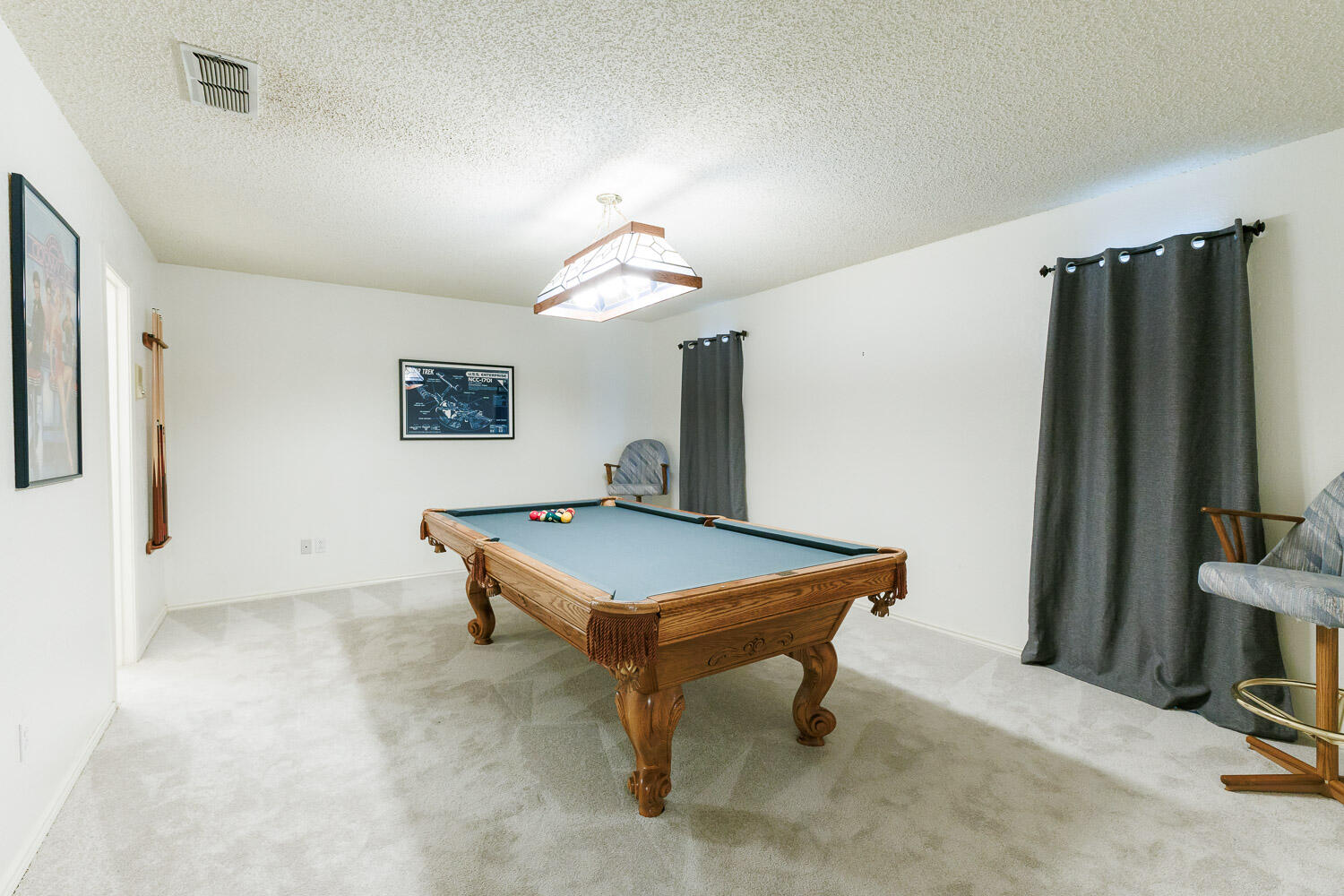 5717 72nd Street Lubbock, TX 79424 - Photo 42 of 54 a room with furniture and a flat screen tv