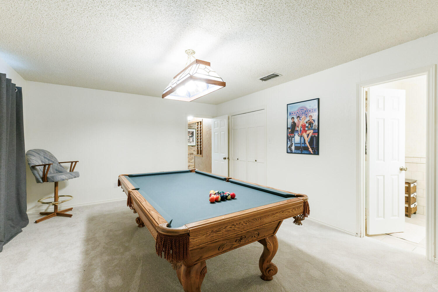 5717 72nd Street Lubbock, TX 79424 - Photo 44 of 54 a room with pool table and windows