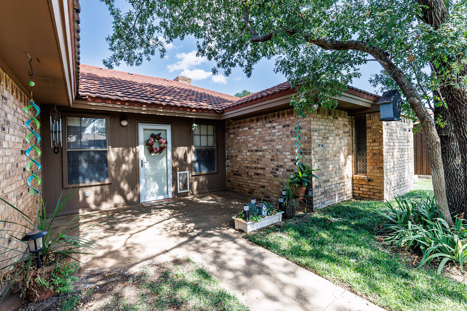 5717 72nd Street Lubbock, TX 79424 - Photo 47 of 54 a front view of a house with garden