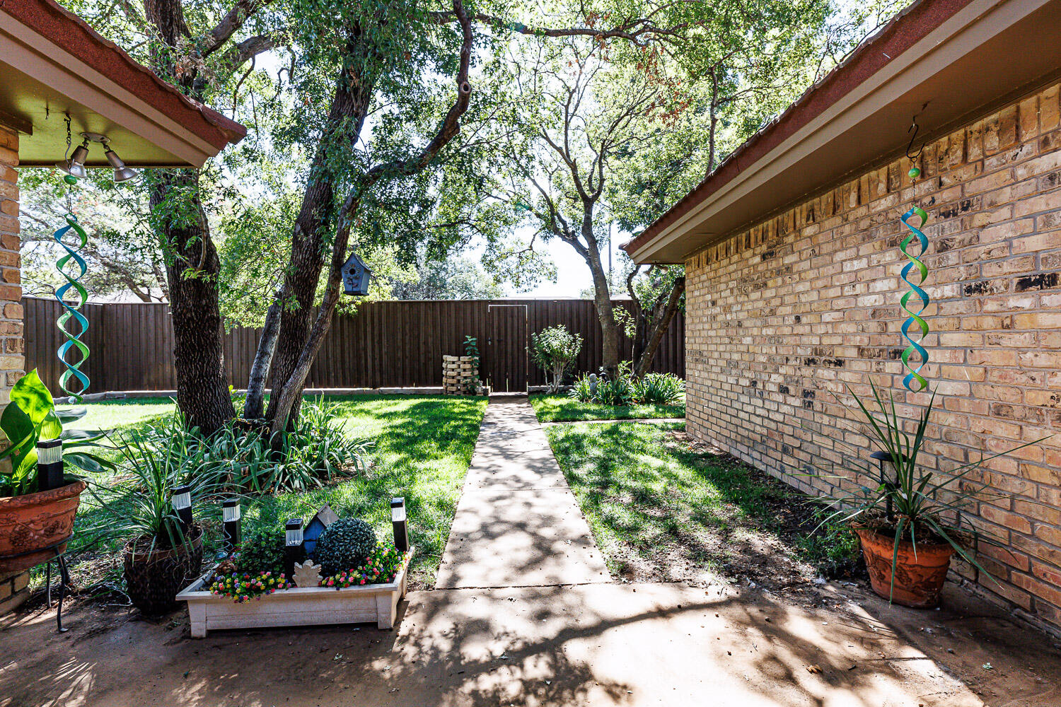 5717 72nd Street Lubbock, TX 79424 - Photo 48 of 54 a view of a garden with plants
