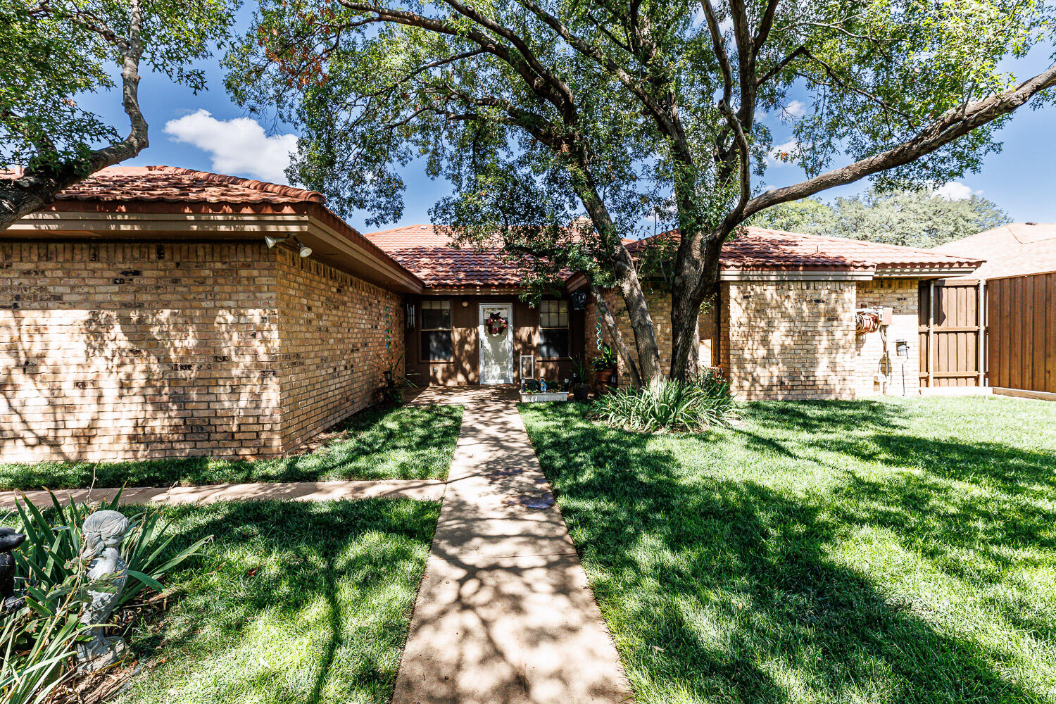 5717 72nd Street Lubbock, TX 79424 - Photo 49 of 54 a backyard of a house with lots of green space