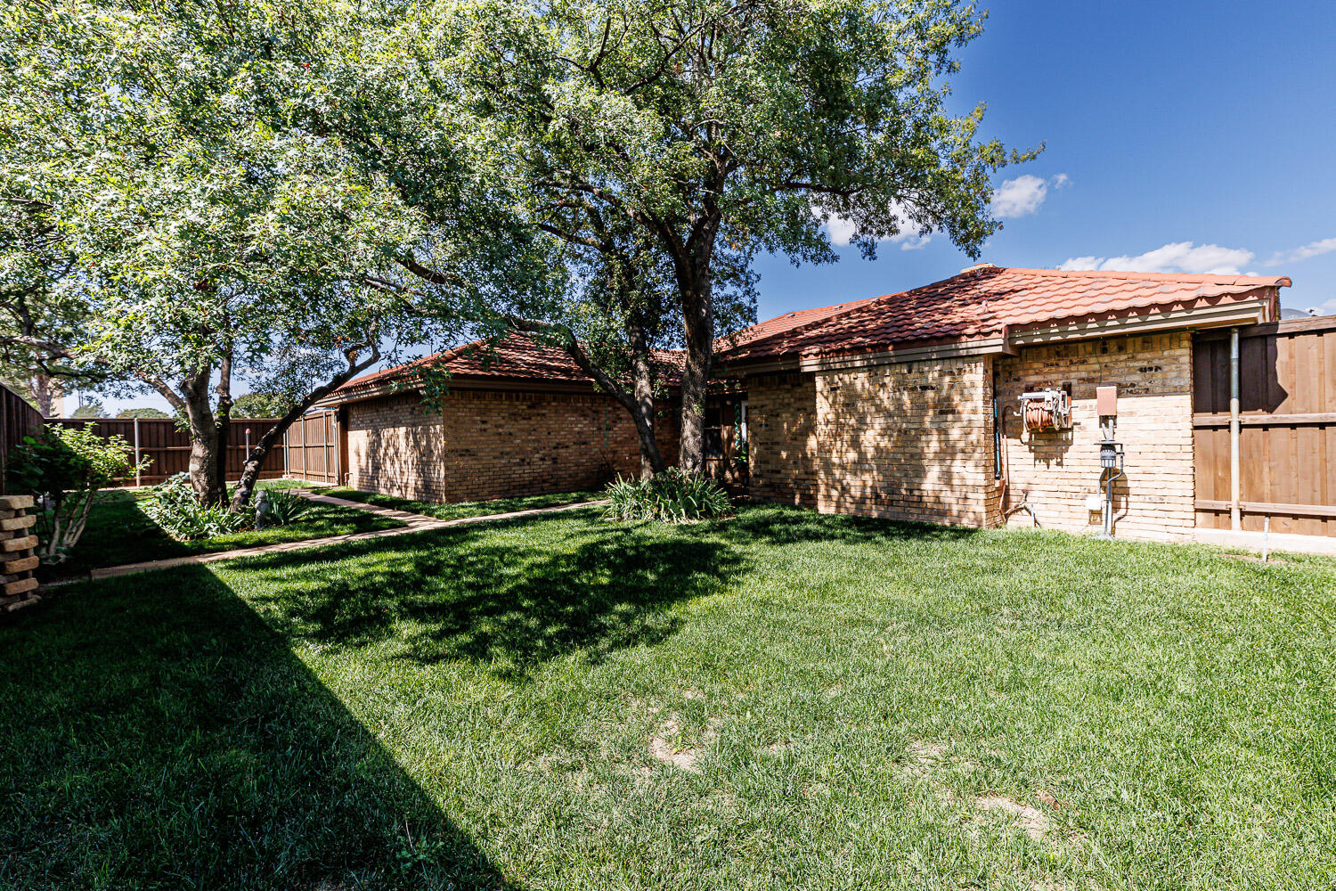 5717 72nd Street Lubbock, TX 79424 - Photo 50 of 54 a front view of a house with garden
