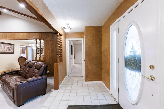 a living room with furniture a couch and a fireplace