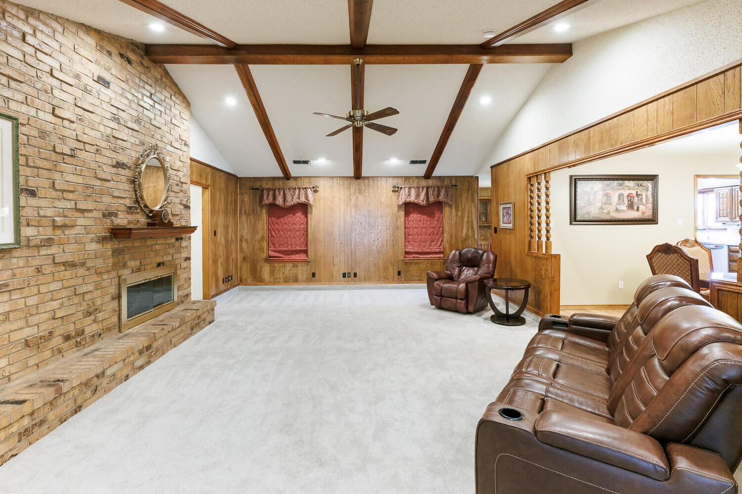 5717 72nd Street Lubbock, TX 79424 - Photo 6 of 54 a living room with furniture a couch and a fireplace