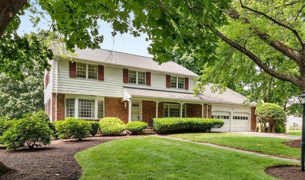 19 Saddle Club Road Lexington, MA 02420 - Photo 1 of 29 a front view of a house with a yard