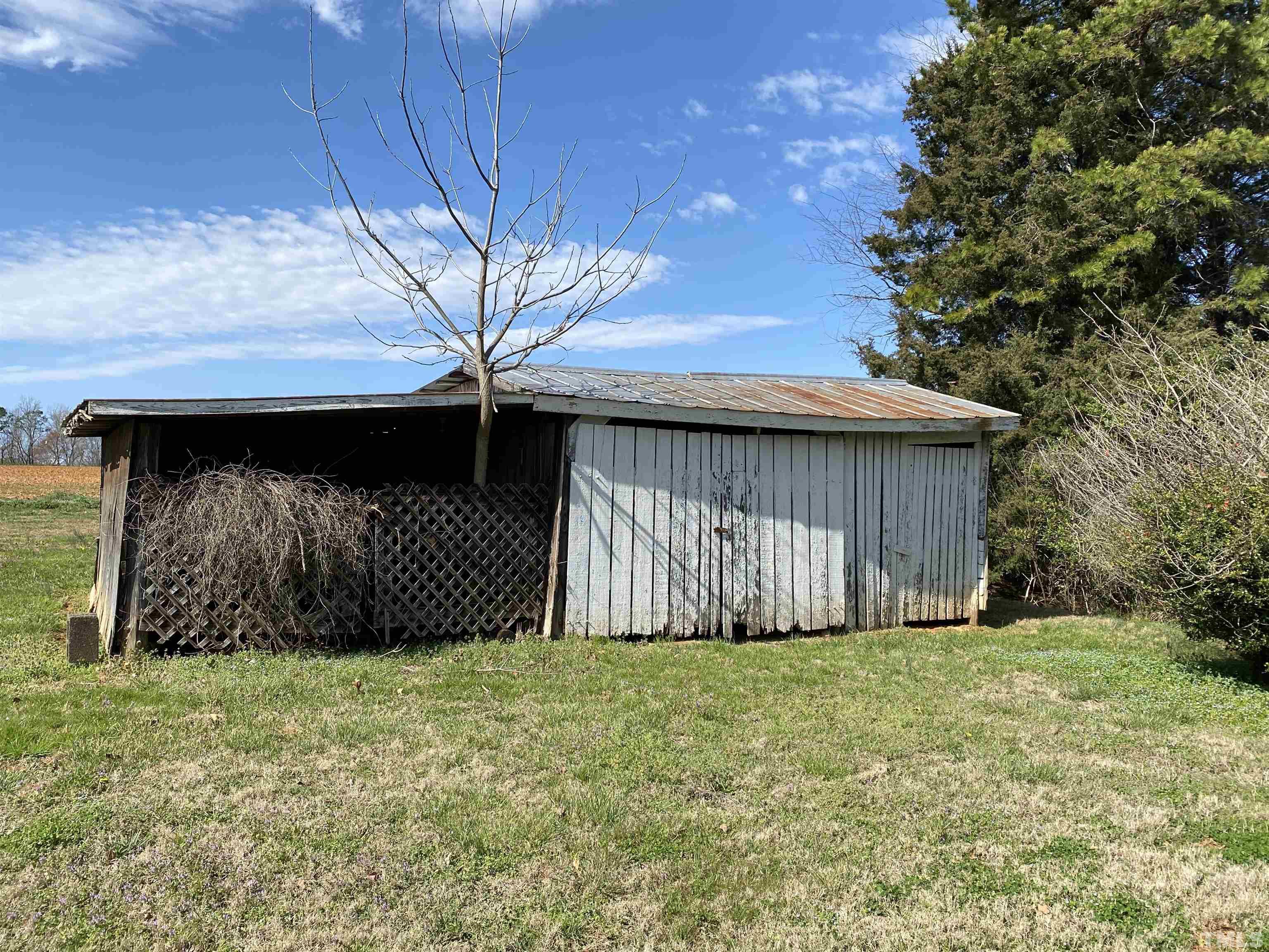 3555 Boston Road Roxboro, NC 27573 - Photo 21 of 21 a view of a backyard of the house