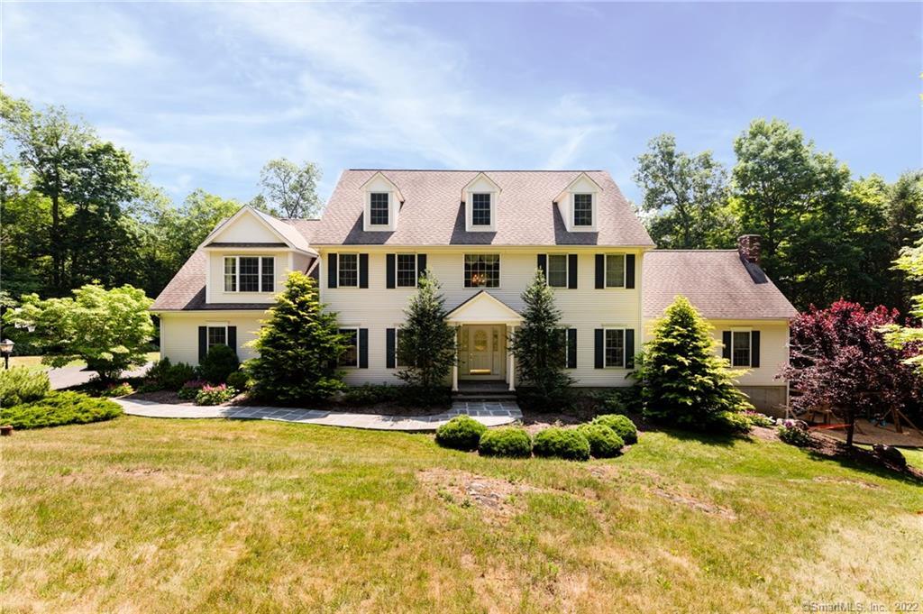 158 Hemlock Ridge Road Southbury, CT 06488 - Photo 1 of 1 a front view of a house with yard and green space