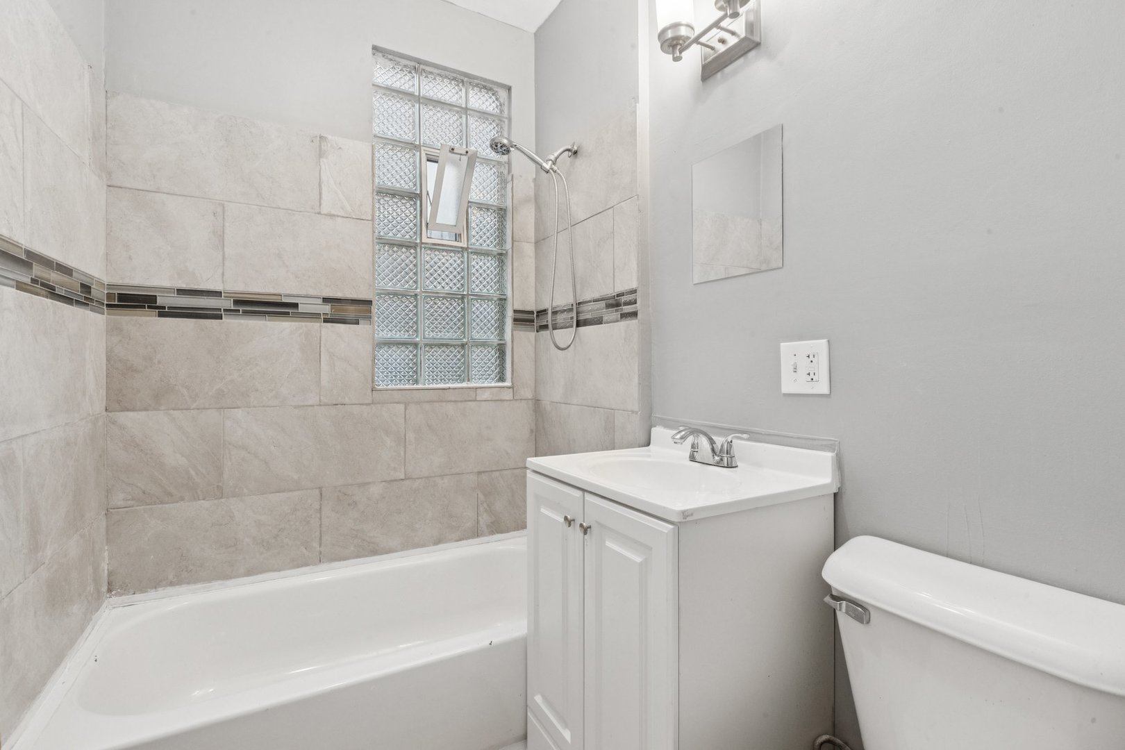 5756 South Princeton Avenue Chicago, IL 60621 - Photo 14 of 31 a bathroom with a sink a toilet and shower