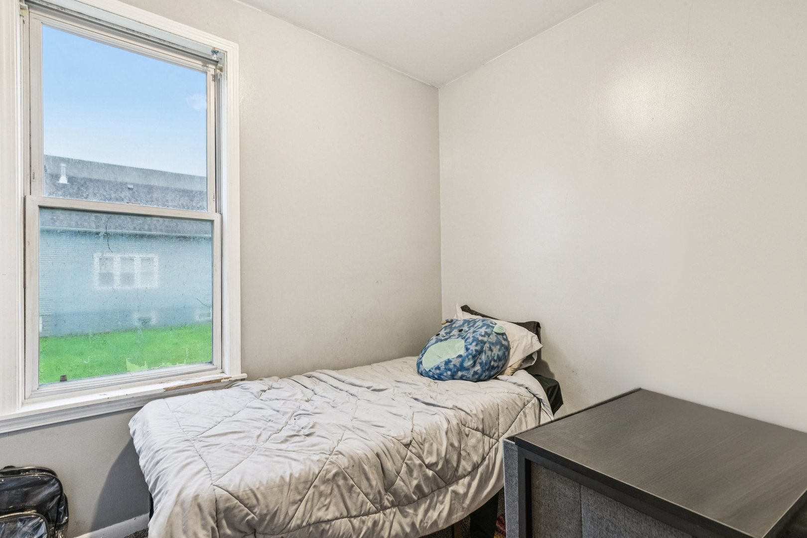 5756 South Princeton Avenue Chicago, IL 60621 - Photo 21 of 31 a bedroom with a bed and a window