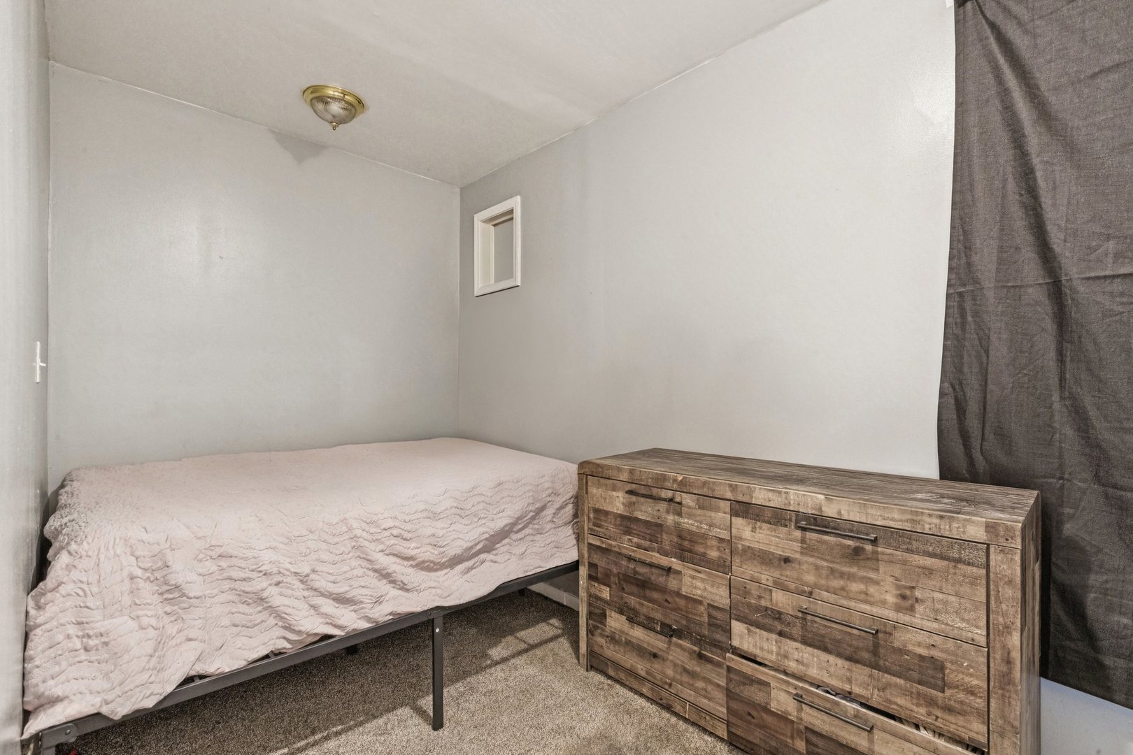 5756 South Princeton Avenue Chicago, IL 60621 - Photo 22 of 31 a bedroom with a bed and a window