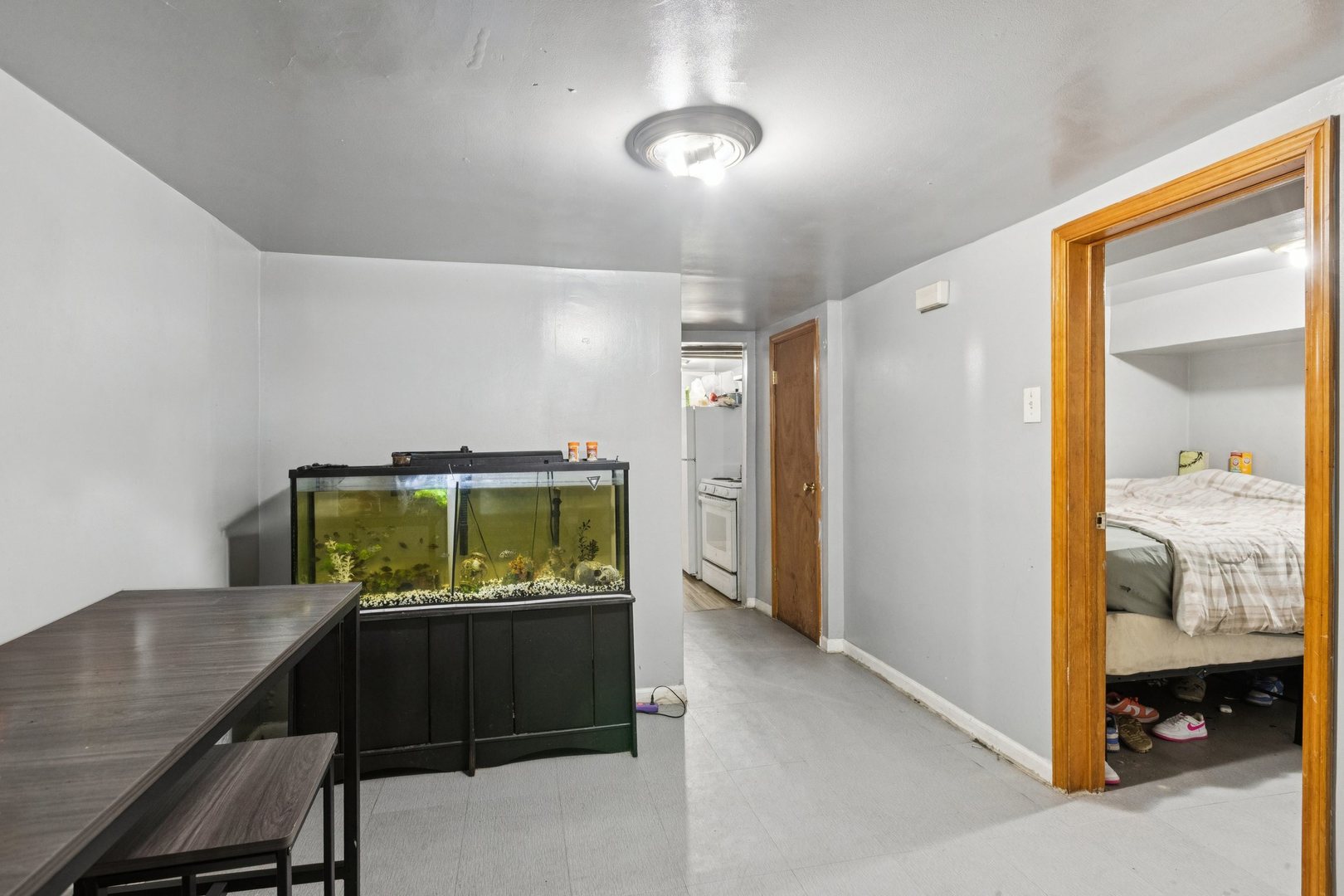 5756 South Princeton Avenue Chicago, IL 60621 - Photo 26 of 31 a living room with furniture and a flat screen tv