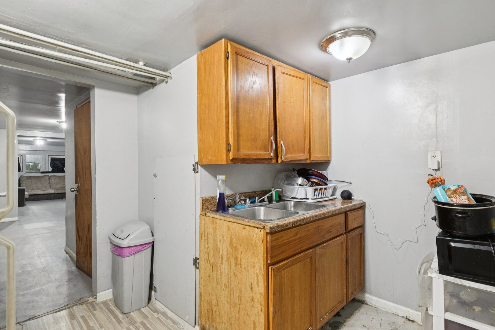 5756 South Princeton Avenue Chicago, IL 60621 - Photo 27 of 31 a bathroom with a sink toilet and shower