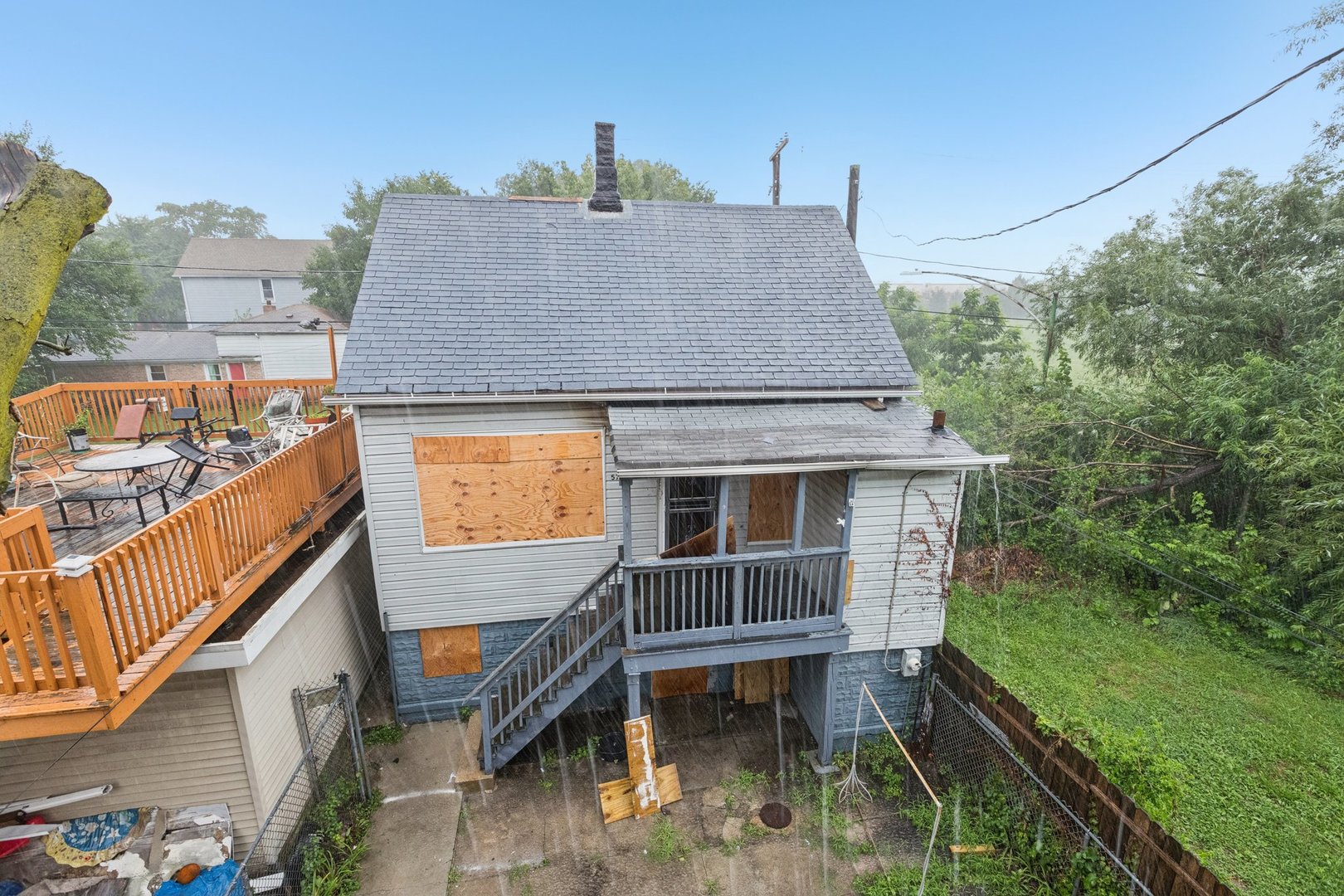 5756 South Princeton Avenue Chicago, IL 60621 - Photo 31 of 31 a aerial view of a house with swimming pool in front of it