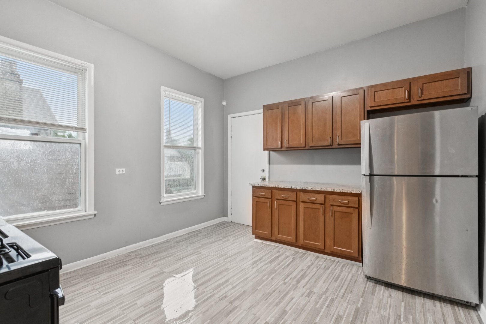 5756 South Princeton Avenue Chicago, IL 60621 - Photo 7 of 31 a kitchen with stainless steel appliances granite countertop a refrigerator sink and cabinets
