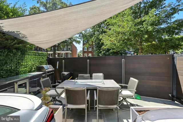 a patio with table and chairs