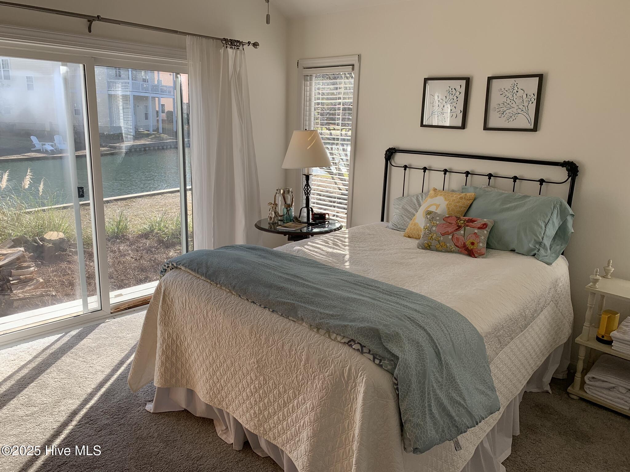 213 Sandfiddler East Emerald Isle, NC 28594 - Photo 19 of 44 Primary Suite with access to the back deck