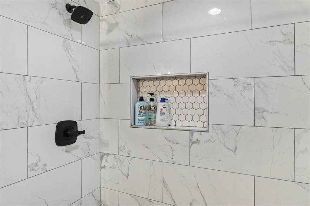 1106 West Chestnut Street Denison, TX 75020 - Photo 38 of 38 Interior details with a tile shower
