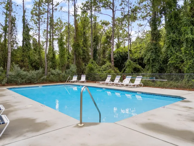 a view of a swimming pool with a yard