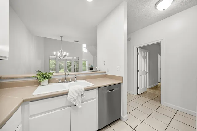 a kitchen with a sink and cabinets