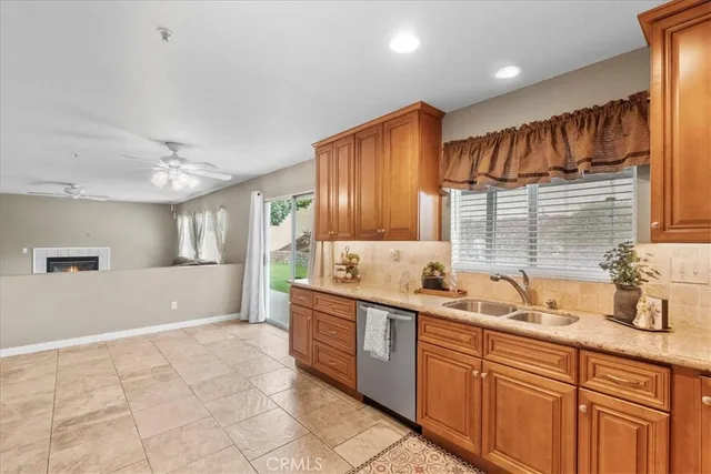 a kitchen with stainless steel appliances a sink stove and cabinets