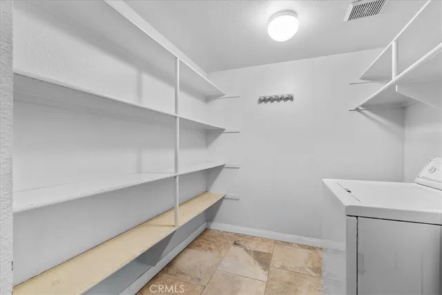 a view of an empty walk in closet