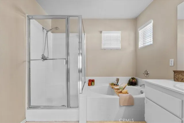 a bathroom with a bathtub sink and vanity