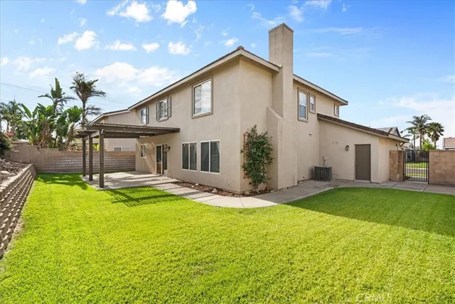 a front view of house with patio and garden