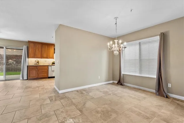 a view of a kitchen with a sink and cabinet
