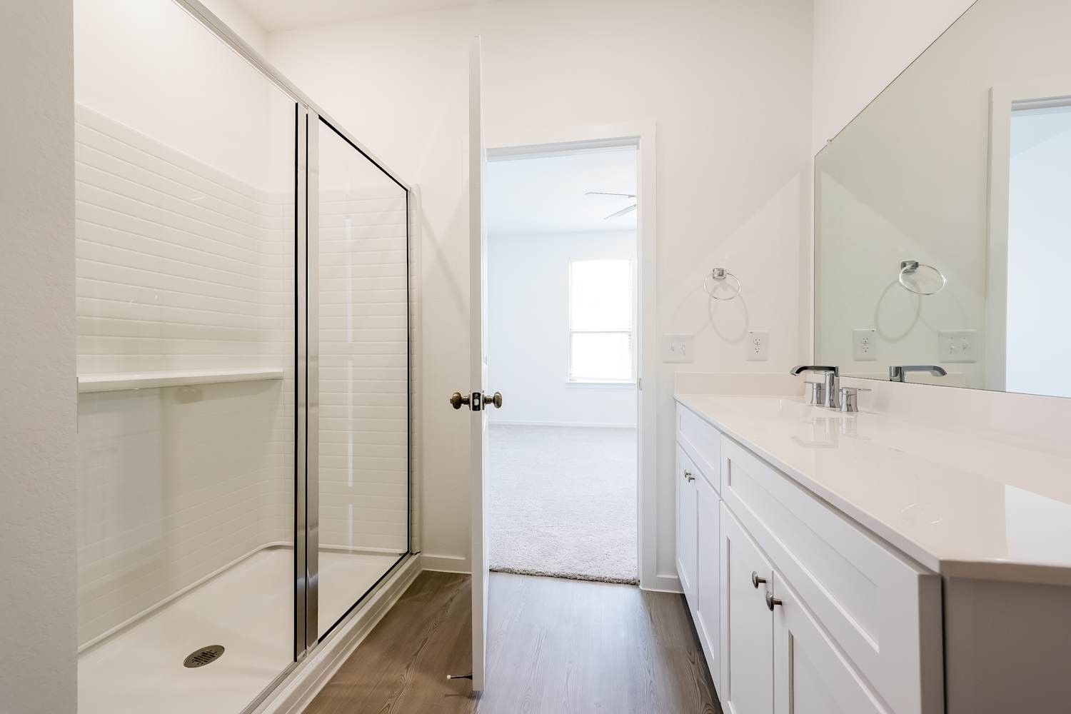 15243 Canyon Rapids Road Conroe, TX 77302 - Photo 12 of 15 a bathroom with a shower sink and mirror