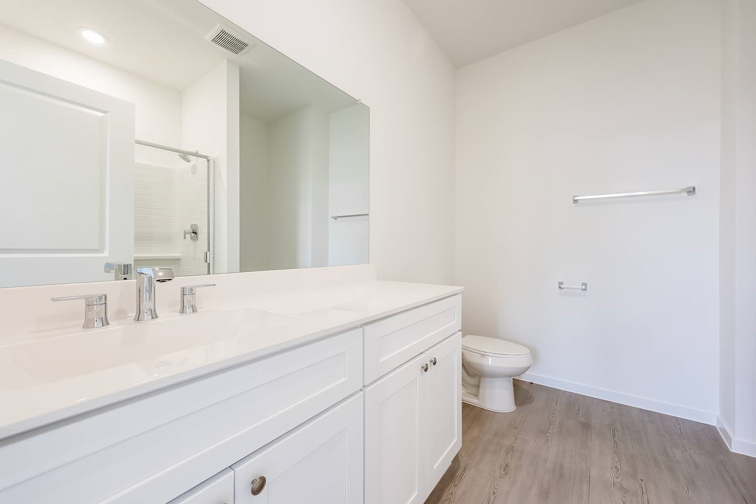 15243 Canyon Rapids Road Conroe, TX 77302 - Photo 13 of 15 a bathroom with a sink a toilet and a mirror