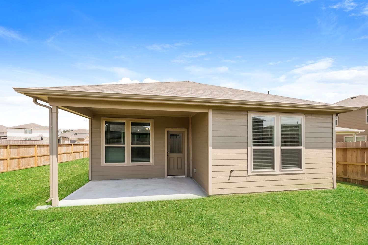 15243 Canyon Rapids Road Conroe, TX 77302 - Photo 14 of 15 front view of a house with a yard