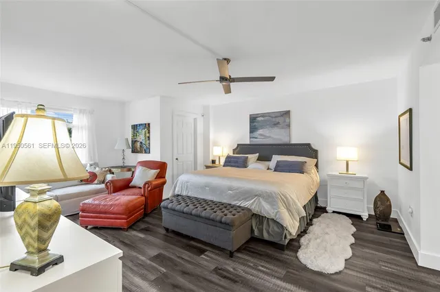 a bathroom with a sink mirror toilet and vanity