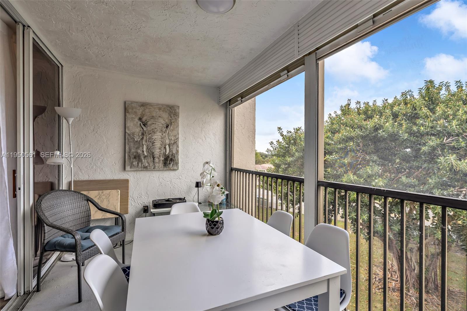 3910 Inverrary Boulevard, Unit 503B Lauderhill, FL 33319 - Photo 24 of 37 a view of a dining room with furniture window and outside view