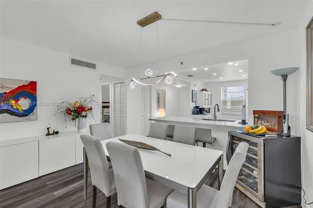 a living room with furniture a rug and a flat screen tv