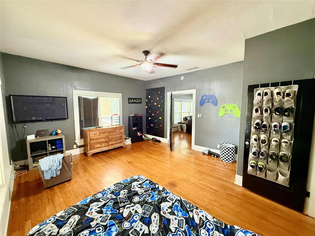 203 Bennett Street Strawn, TX 76475 - Photo 15 of 28 a living room with furniture and a flat screen tv