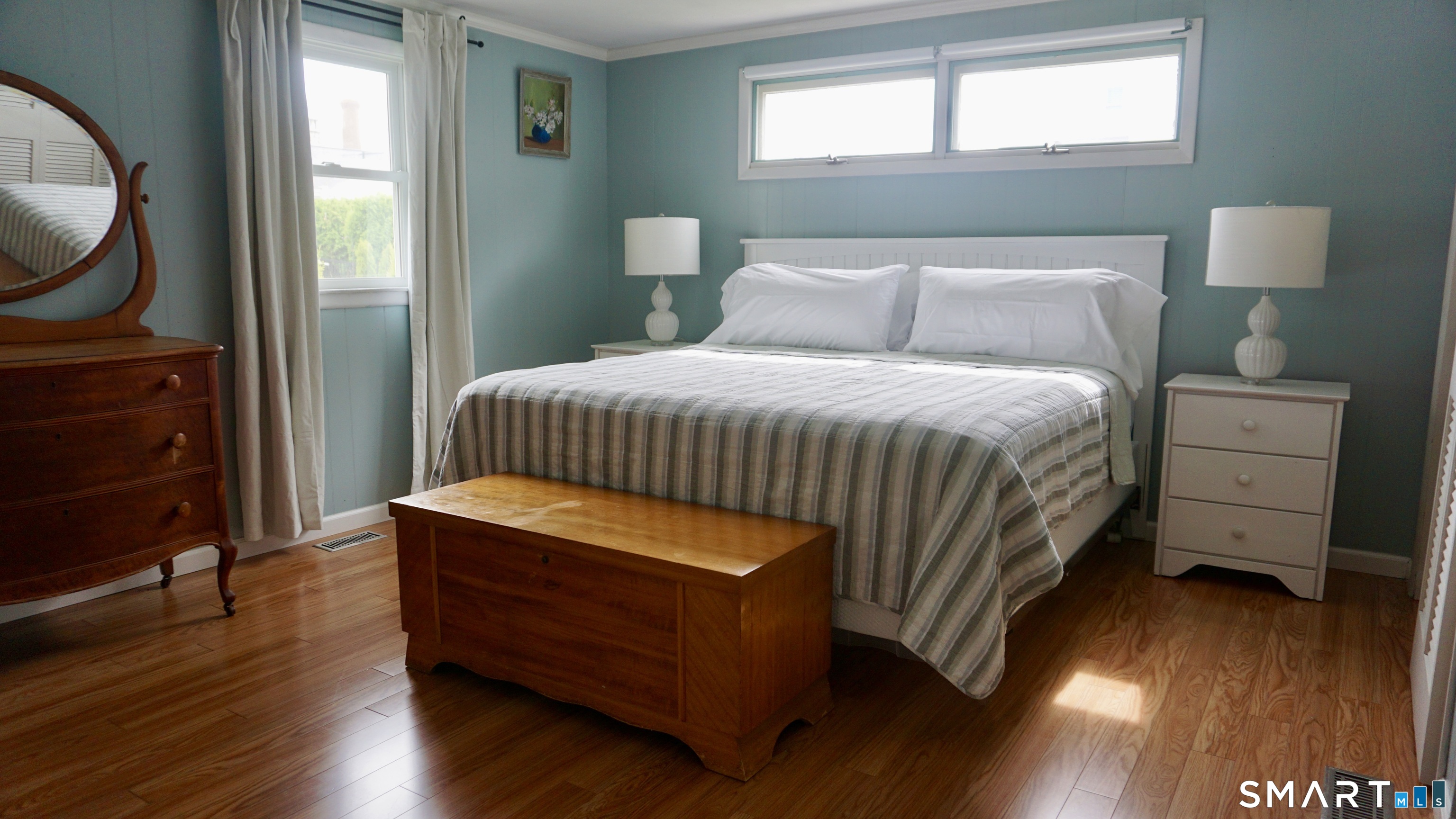 13 Pacific Street Groton, CT 06340 - Photo 27 of 31 a bedroom with a bed and wooden floor