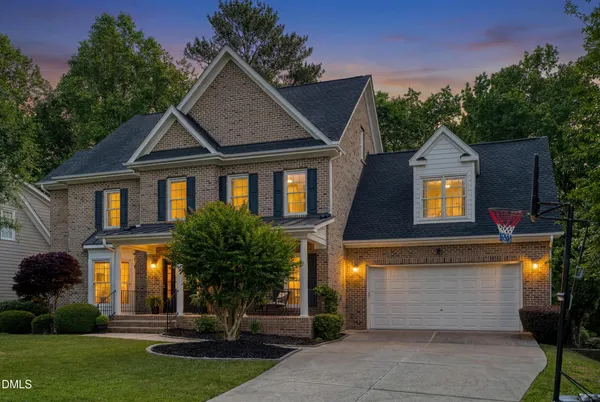a kitchen with stainless steel appliances granite countertop a sink a stove and cabinets