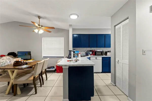 a kitchen with a sink cabinets and window