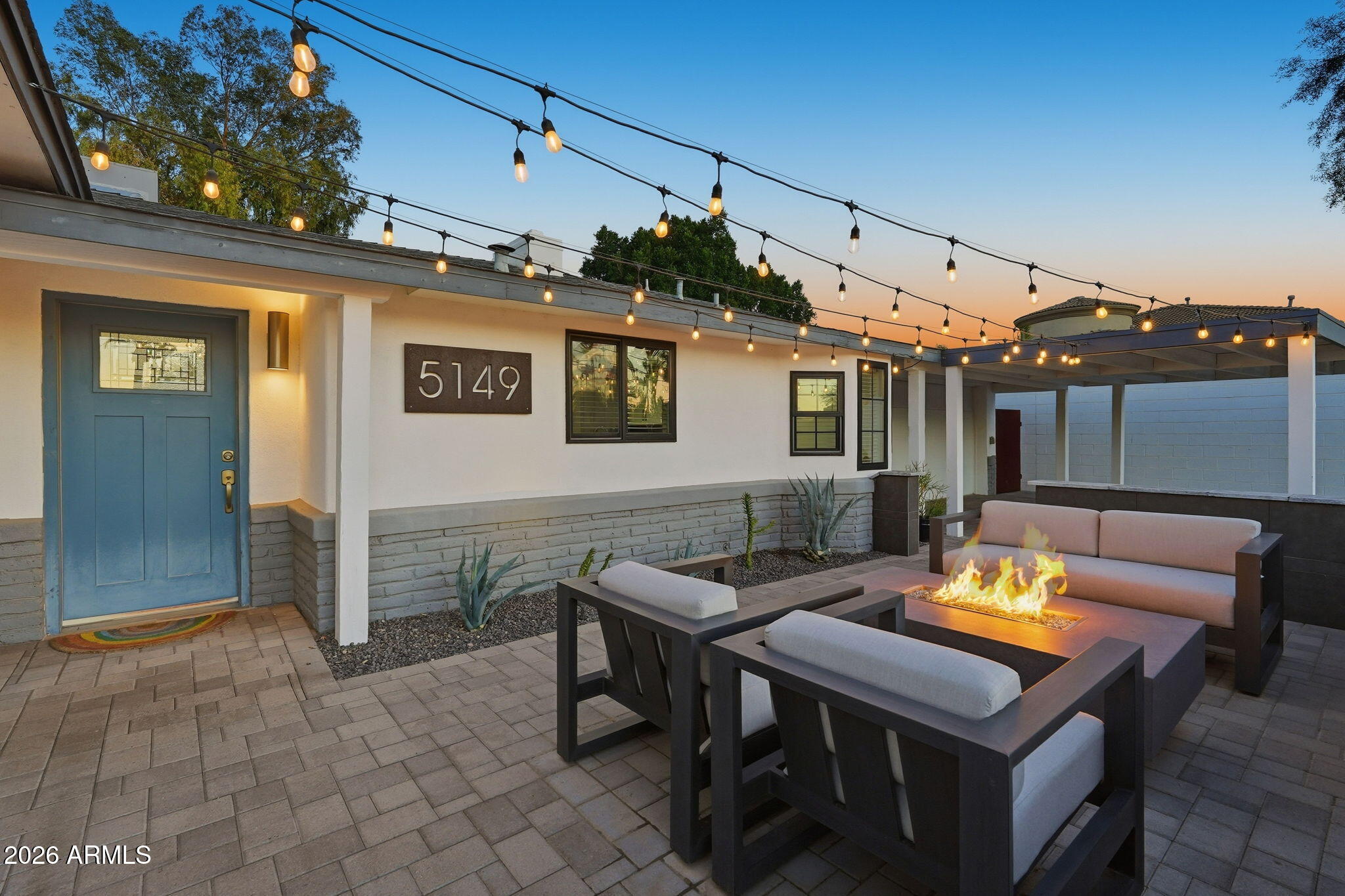 5149 North 34th Street Phoenix, AZ 85018 - Photo 7 of 70 a backyard of a house with sofas table and chairs