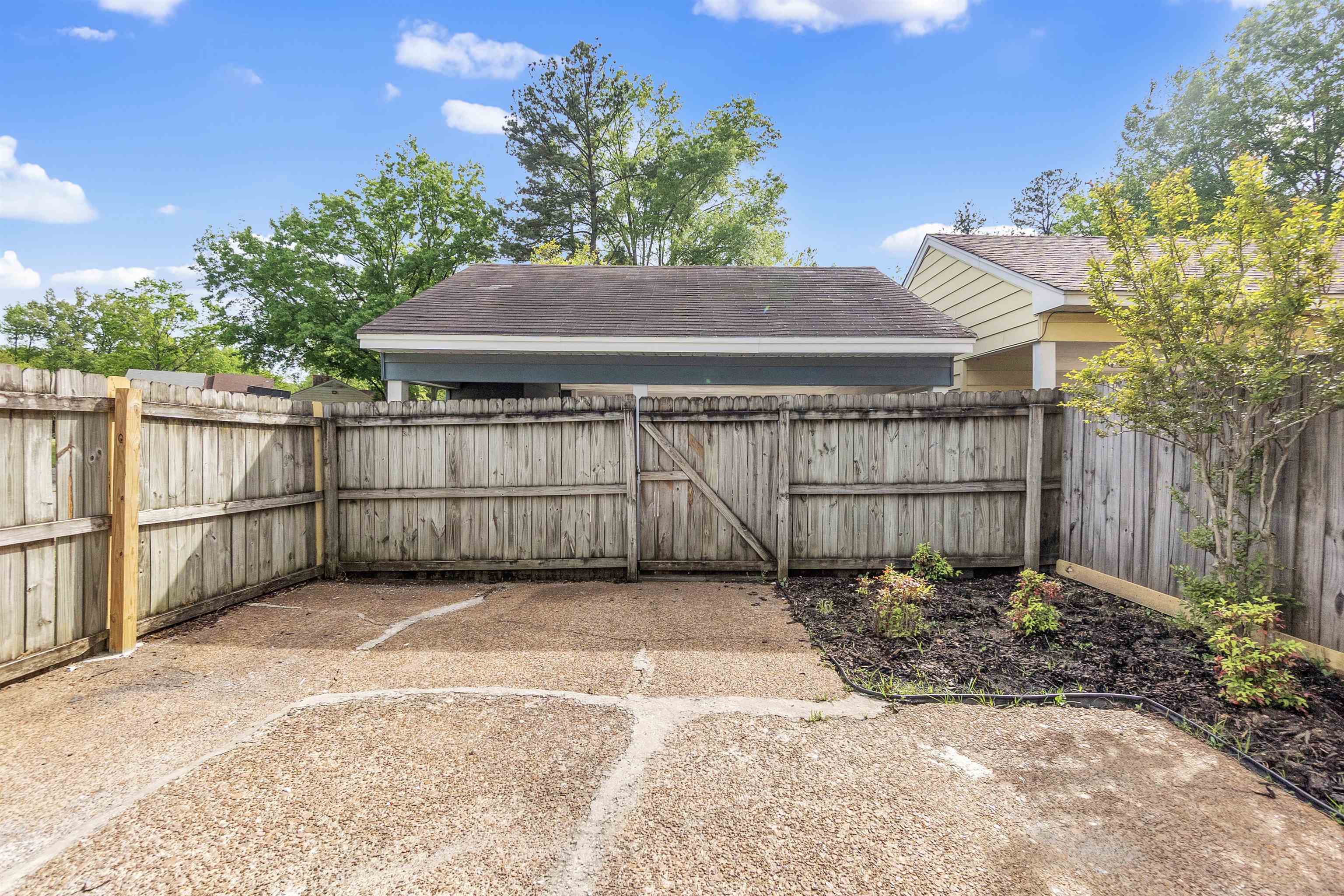 3100 Castlebay Road, Unit 30 Memphis, TN 38128 - Photo 5 of 24 View of yard with a fenced backyard and a gate