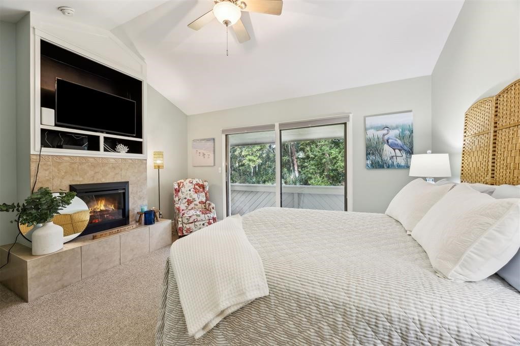 3033 Sea Marsh Road Fernandina Beach, FL 32034 - Photo 25 of 37 a bedroom with a bed and a flat screen tv