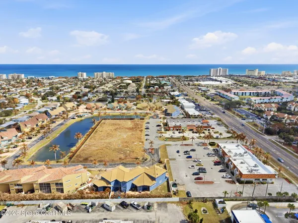 an aerial view of residential building and parking space
