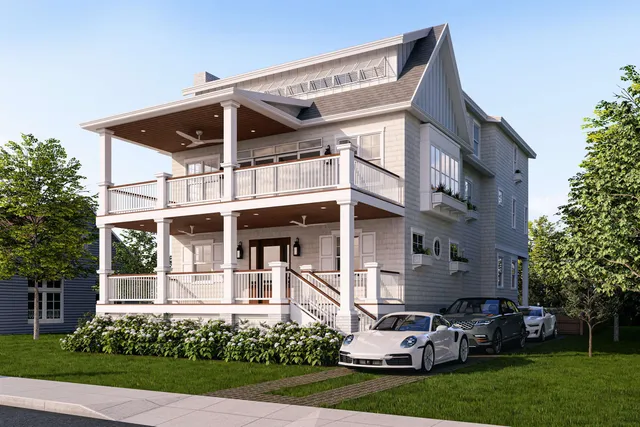 a view of a white house with a large windows and a yard with plants and large trees