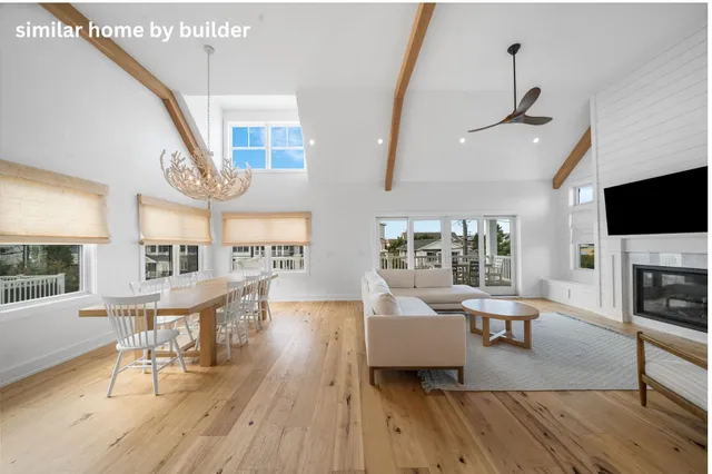 a living room with furniture fireplace and a flat screen tv