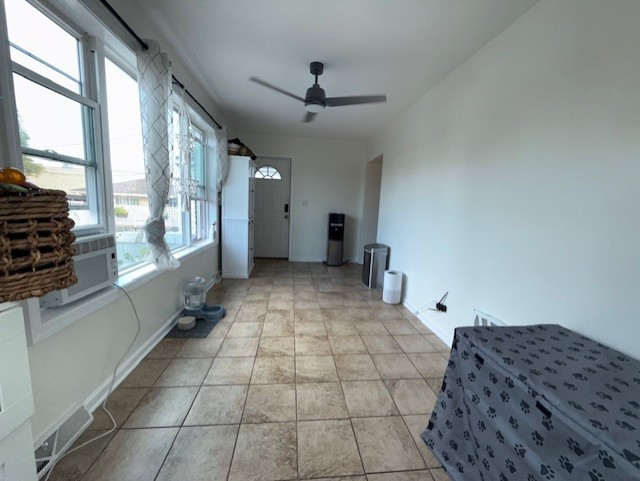 3406 West 74th Street Chicago, IL 60629 - Photo 14 of 47 a view of a hallway with windows and chandelier