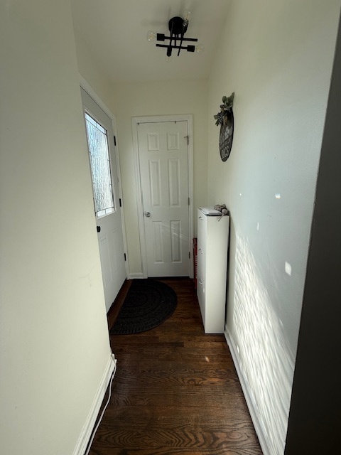 3406 West 74th Street Chicago, IL 60629 - Photo 4 of 47 a view of a hallway with wooden floor