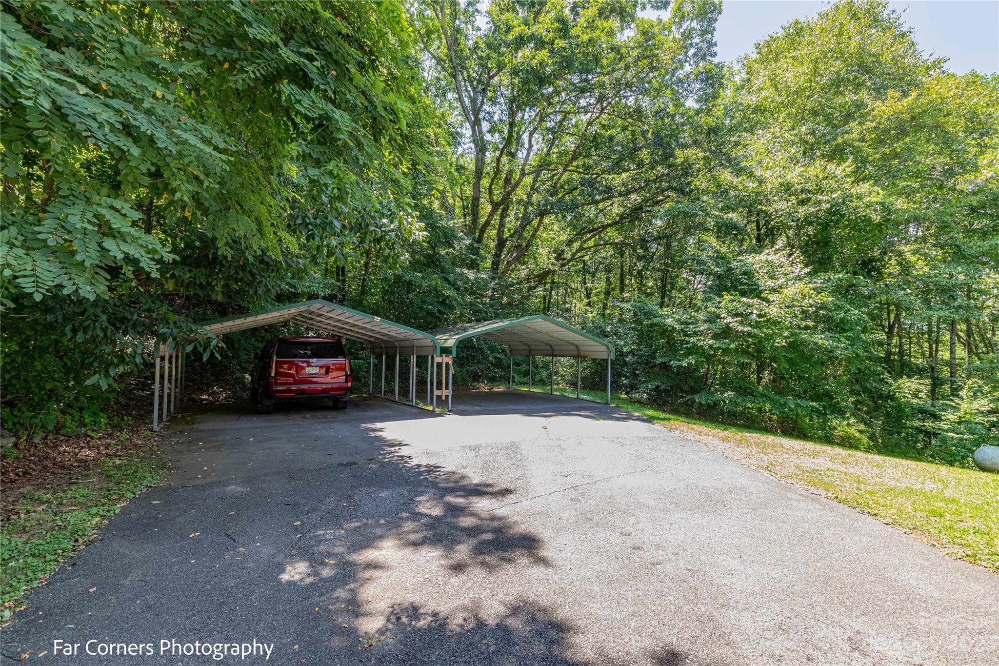 1454 Sorrells Cove Road Clyde, NC 28721 - Photo 11 of 26 a view of a car parked in a yard