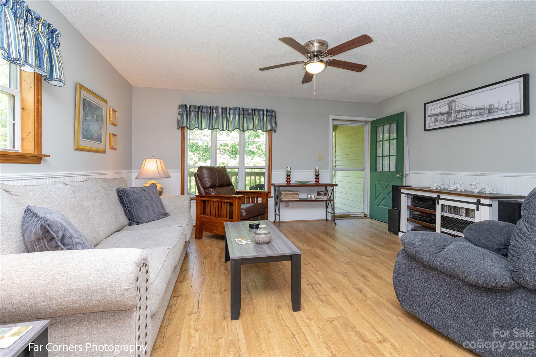 1454 Sorrells Cove Road Clyde, NC 28721 - Photo 12 of 26 a living room with furniture ceiling fan and a window