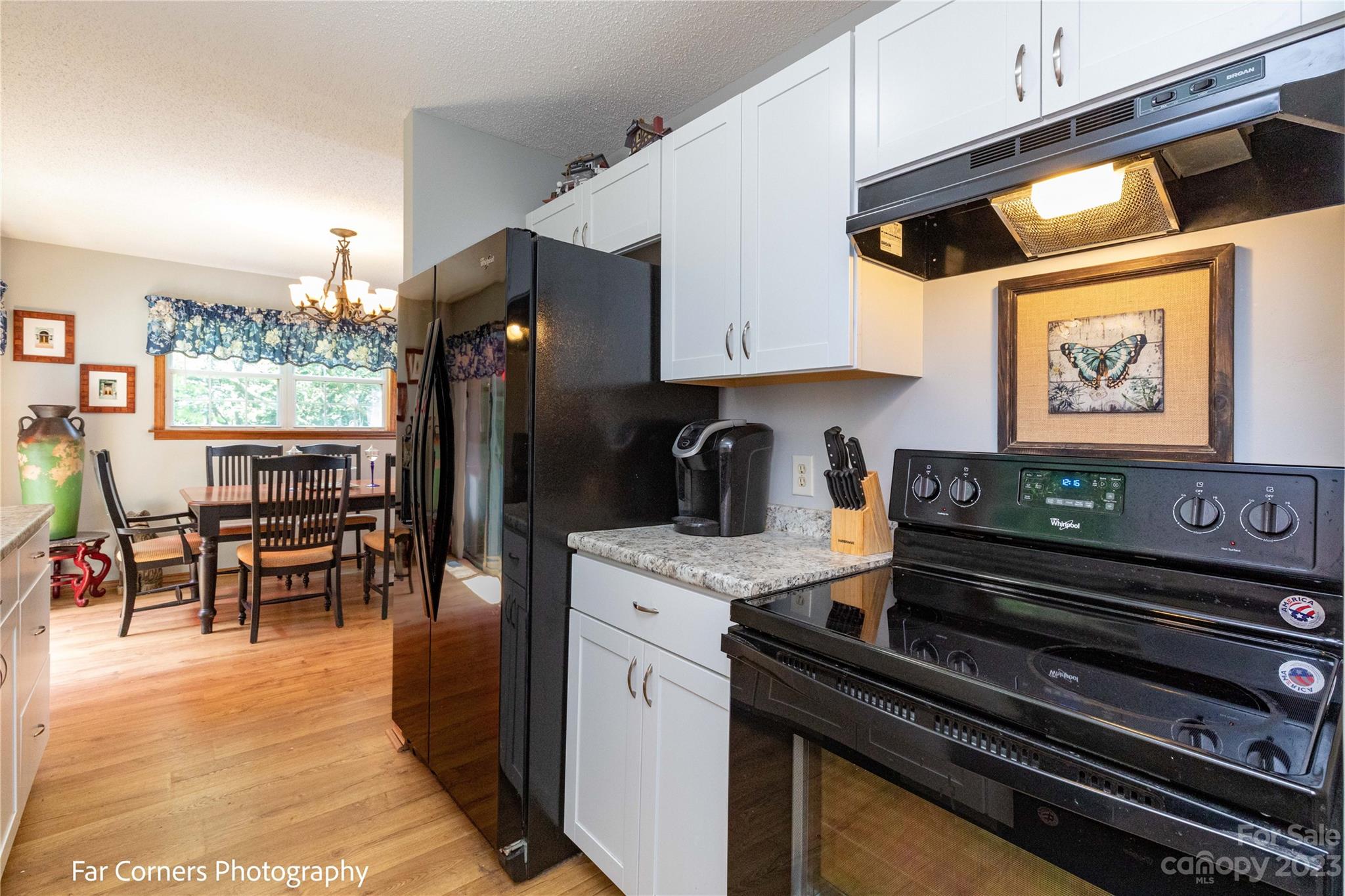 1454 Sorrells Cove Road Clyde, NC 28721 - Photo 16 of 26 a kitchen with stainless steel appliances granite countertop a stove and cabinets