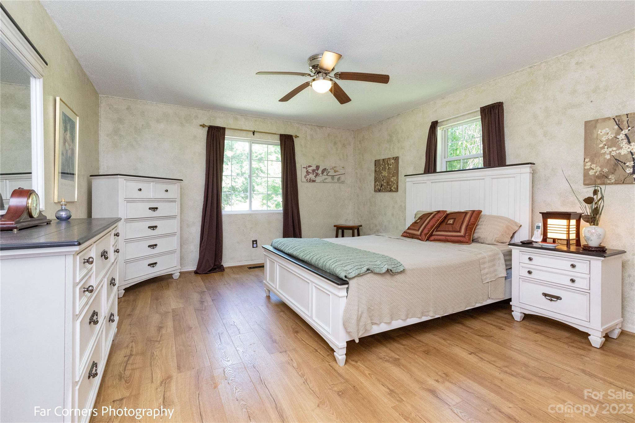 1454 Sorrells Cove Road Clyde, NC 28721 - Photo 19 of 26 a bedroom with a bed and a dresser